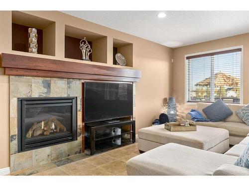 310 Evanspark Circle Nw, Calgary, AB - Indoor Photo Showing Living Room With Fireplace