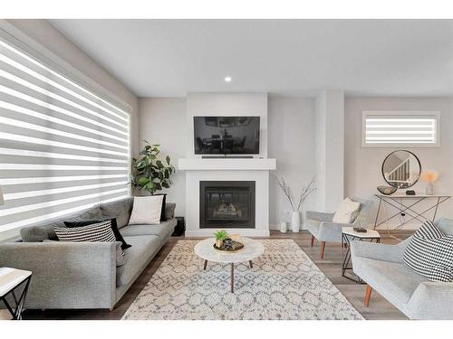 202 Sage Bluff Rise Nw, Calgary, AB - Indoor Photo Showing Living Room With Fireplace