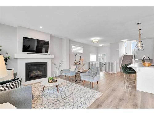 202 Sage Bluff Rise Nw, Calgary, AB - Indoor Photo Showing Living Room With Fireplace