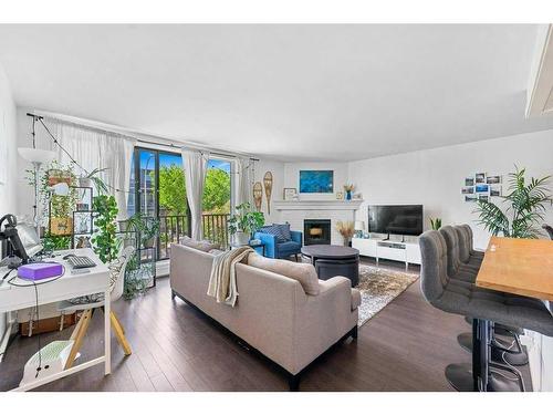 B-518 18 Avenue Sw, Calgary, AB - Indoor Photo Showing Living Room With Fireplace