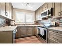 12 Penswood Place Se, Calgary, AB  - Indoor Photo Showing Kitchen With Upgraded Kitchen 