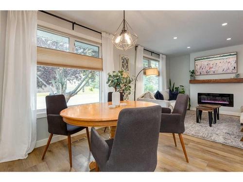 6959 Silver Springs Road Nw, Calgary, AB - Indoor Photo Showing Dining Room With Fireplace