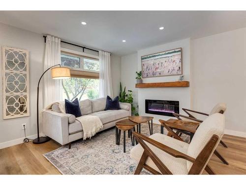 6959 Silver Springs Road Nw, Calgary, AB - Indoor Photo Showing Living Room With Fireplace