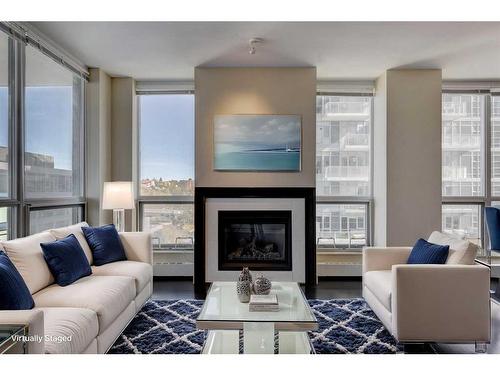 913-222 Riverfront Avenue Sw, Calgary, AB - Indoor Photo Showing Living Room With Fireplace