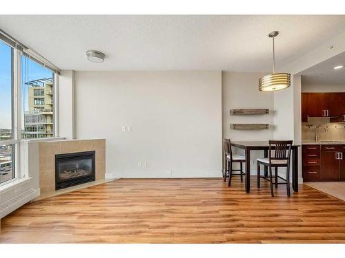 1804-77 Spruce Place Sw, Calgary, AB - Indoor With Fireplace