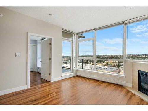 1804-77 Spruce Place Sw, Calgary, AB - Indoor Photo Showing Living Room With Fireplace