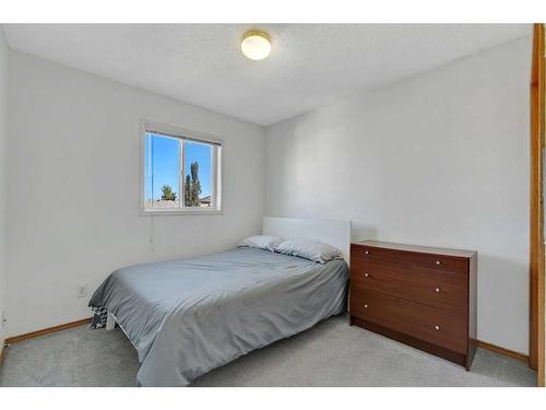 16 Erin Circle Se, Calgary, AB - Indoor Photo Showing Bedroom