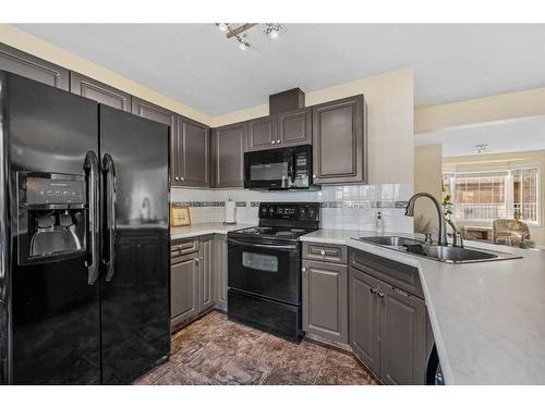 1-2208 29 Street Sw, Calgary, AB - Indoor Photo Showing Kitchen With Double Sink