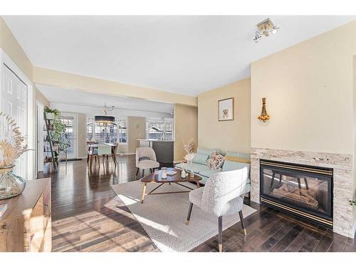 1-2208 29 Street Sw, Calgary, AB - Indoor Photo Showing Living Room With Fireplace