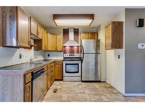 885 Queensland Drive Se, Calgary, AB - Indoor Photo Showing Kitchen With Stainless Steel Kitchen