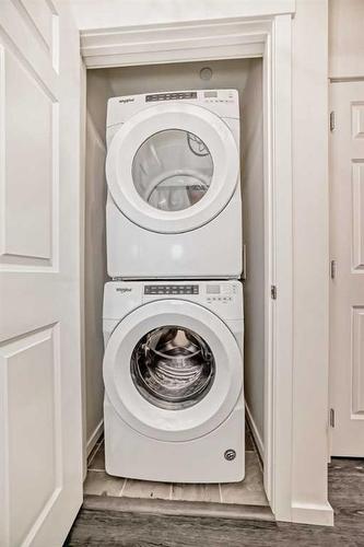 7312-151 Legacy Main Street Se, Calgary, AB - Indoor Photo Showing Laundry Room