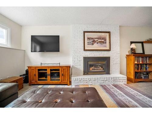 1264 Lake Sundance Crescent Se, Calgary, AB - Indoor Photo Showing Living Room With Fireplace