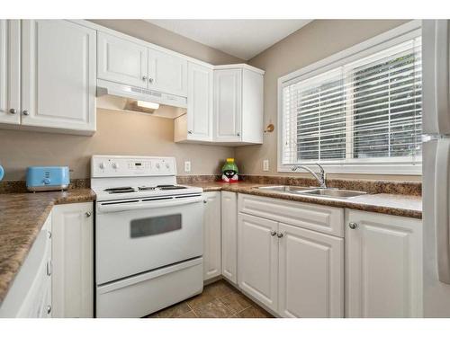 216-630 8 Avenue Se, Calgary, AB - Indoor Photo Showing Kitchen With Double Sink