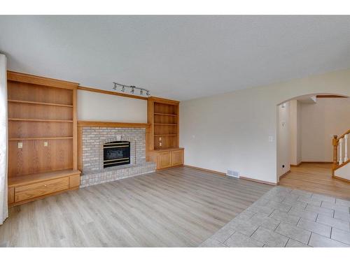 78 Hampstead Circle Nw, Calgary, AB - Indoor Photo Showing Living Room With Fireplace