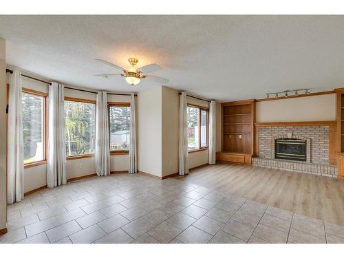 78 Hampstead Circle Nw, Calgary, AB - Indoor Photo Showing Living Room With Fireplace