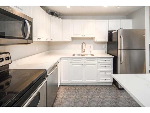 310-545 18 Avenue Sw, Calgary, AB - Indoor Photo Showing Kitchen With Stainless Steel Kitchen With Double Sink