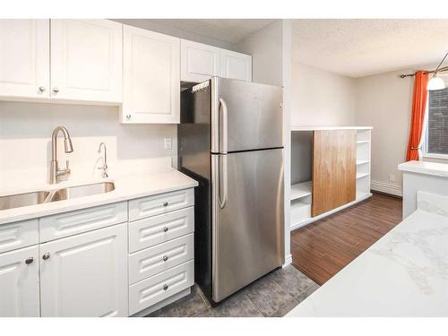 310-545 18 Avenue Sw, Calgary, AB - Indoor Photo Showing Kitchen With Stainless Steel Kitchen With Double Sink