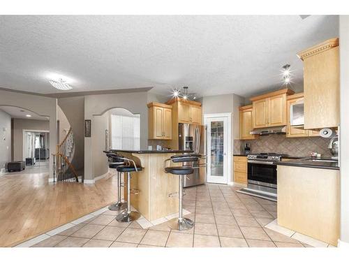 75 West Cedar Rise Sw, Calgary, AB - Indoor Photo Showing Kitchen With Stainless Steel Kitchen