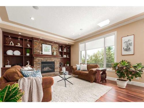 227 Aspen Ridge Place Sw, Calgary, AB - Indoor Photo Showing Living Room With Fireplace