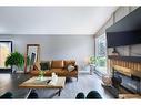 243 Cedarbrae Crescent Sw, Calgary, AB  - Indoor Photo Showing Living Room With Fireplace 