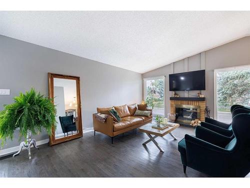 243 Cedarbrae Crescent Sw, Calgary, AB - Indoor Photo Showing Living Room With Fireplace