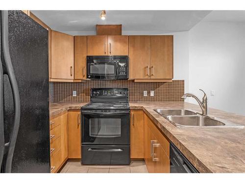 1504-210 15 Avenue Se, Calgary, AB - Indoor Photo Showing Kitchen With Double Sink