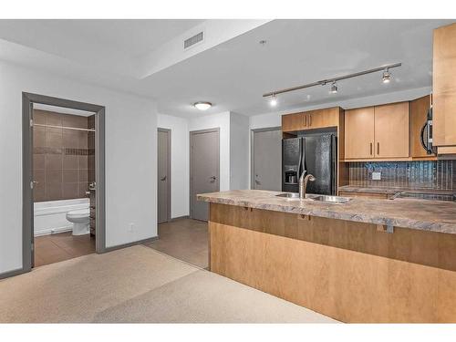 1504-210 15 Avenue Se, Calgary, AB - Indoor Photo Showing Kitchen With Double Sink