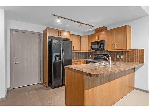 1504-210 15 Avenue Se, Calgary, AB - Indoor Photo Showing Kitchen With Double Sink