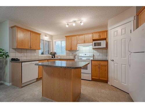 94 Cougar Plateau Way Sw, Calgary, AB - Indoor Photo Showing Kitchen