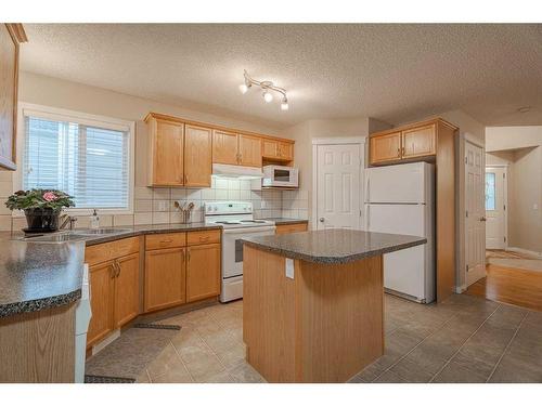 94 Cougar Plateau Way Sw, Calgary, AB - Indoor Photo Showing Kitchen