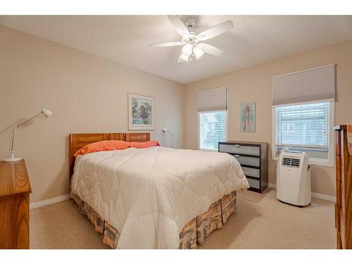 94 Cougar Plateau Way Sw, Calgary, AB - Indoor Photo Showing Bedroom