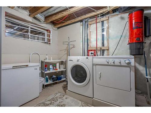 94 Cougar Plateau Way Sw, Calgary, AB - Indoor Photo Showing Laundry Room