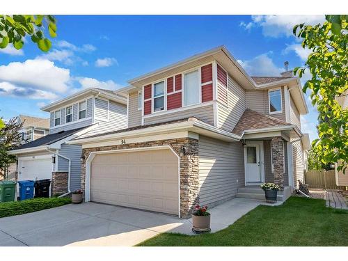 94 Cougar Plateau Way Sw, Calgary, AB - Outdoor With Facade