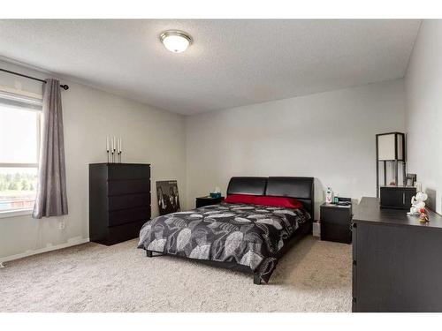 256 Oakmere Place, Chestermere, AB - Indoor Photo Showing Bedroom