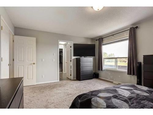 256 Oakmere Place, Chestermere, AB - Indoor Photo Showing Bedroom