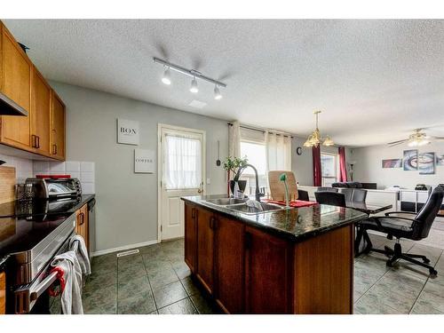 256 Oakmere Place, Chestermere, AB - Indoor Photo Showing Kitchen With Double Sink