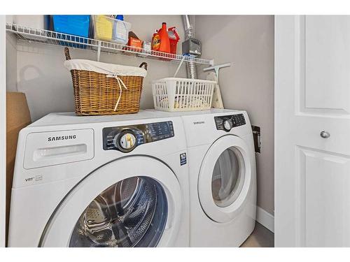 60 Cougar Ridge Landing Sw, Calgary, AB - Indoor Photo Showing Laundry Room