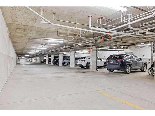 60 Cougar Ridge Landing Sw, Calgary, AB - Indoor Photo Showing Garage