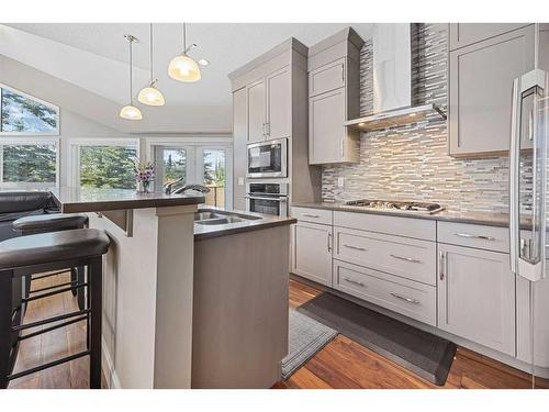 60 Cougar Ridge Landing Sw, Calgary, AB - Indoor Photo Showing Kitchen With Double Sink With Upgraded Kitchen