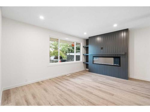 5731 Dalhousie Drive Nw, Calgary, AB - Indoor Photo Showing Living Room With Fireplace