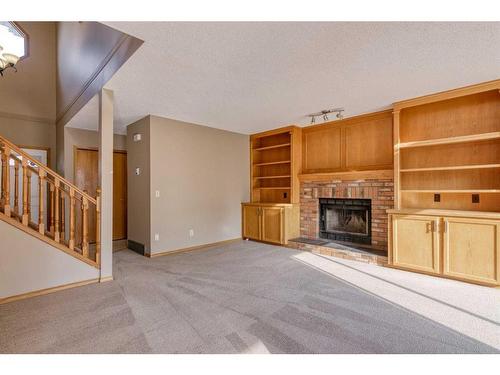 105 Hawkdale Circle Nw, Calgary, AB - Indoor With Fireplace