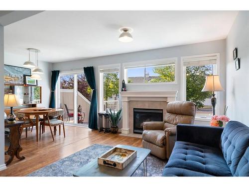 15 Royal Birch Mount Nw, Calgary, AB - Indoor Photo Showing Living Room With Fireplace