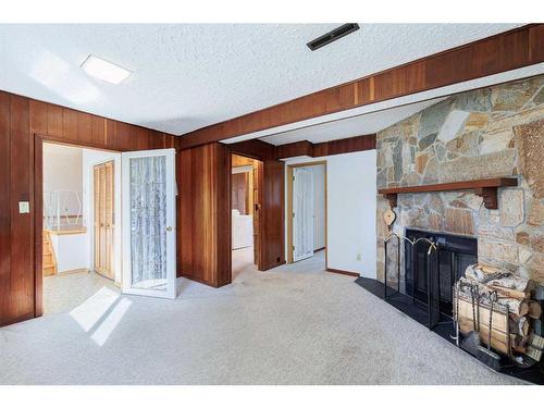 14 Glacier Place Sw, Calgary, AB - Indoor With Fireplace