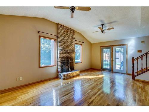 23 Bow Village Crescent Nw, Calgary, AB - Indoor Photo Showing Other Room With Fireplace