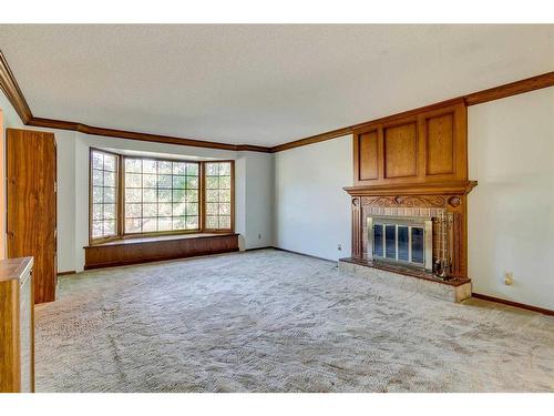 23 Bow Village Crescent Nw, Calgary, AB - Indoor Photo Showing Other Room With Fireplace