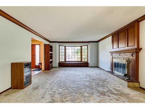 23 Bow Village Crescent Nw, Calgary, AB - Indoor Photo Showing Other Room With Fireplace