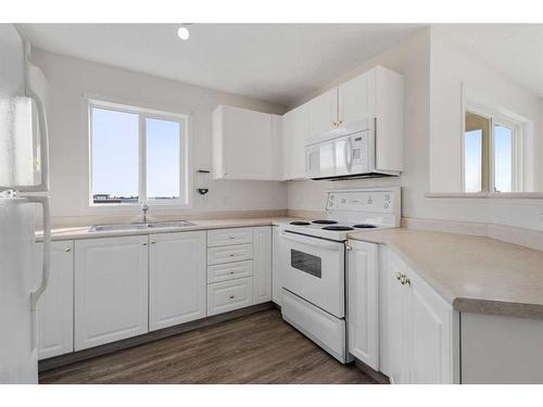 418-2000 Somervale Court Sw, Calgary, AB - Indoor Photo Showing Kitchen With Double Sink