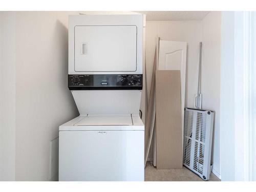 418-2000 Somervale Court Sw, Calgary, AB - Indoor Photo Showing Laundry Room