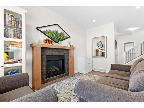 6 Coutts Close, Olds, AB - Indoor Photo Showing Living Room With Fireplace