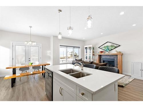 6 Coutts Close, Olds, AB - Indoor Photo Showing Kitchen With Fireplace With Double Sink